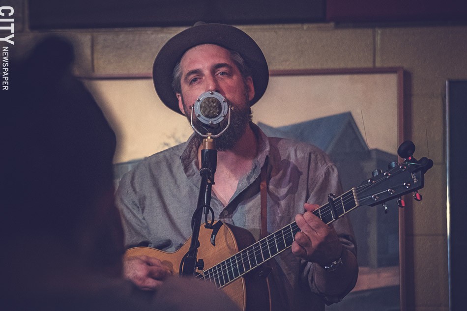 Ben Haravitch, a.k.a. Benny Bleu, performing during his August residency at The Little Theatre Cafe. - PHOTO BY RYAN WILLIAMSON