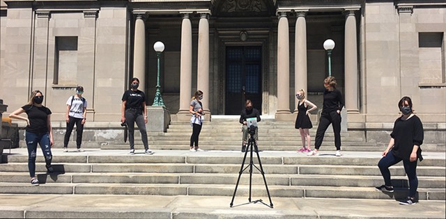MAG Director Jonathan Binstock, center, sits on the gallery steps and awaits his fate. Find out what donors to the fundraiser decided at 3 p.m. on Thursday, May 28. - PHOTO PROVIDED