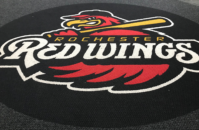 The Rochester Red Wings logo is emblazoned on the carpet of the team's clubhouse. - PHOTO BY DAVID ANDREATTA