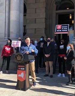 Assemlbyman Ron Kim, D- Queens spoke at a rally to celebrate the inclusion of new taxes on the wealthy and increased school funding in the state budget, at a rally outside the State Capitol on April 7, 2021 - PHOTO BY KAREN DEWITT