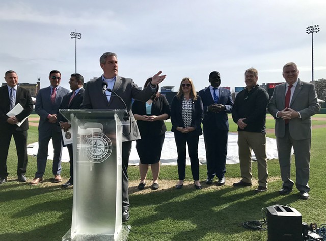 Monroe County Executive Adam Bello, flanked by state and county officials, announces a $26 million investment to renovate Frontier Field on April 25, 2022. The cost will effectively be split by county and state taxpayers. - PHOTO BY DAVID ANDREATTA