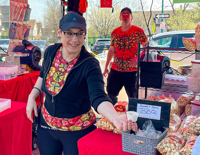Danielle Marvella, owner of Rochester Kettle Corn, serves up the treat in a variety of flavors with her partner, Joseph Powell, and daughter, Alexandria Porter, at the Rochester Public Market and more than a dozen festivals and events. - PHOTO BY REBECCA RAFFERTY