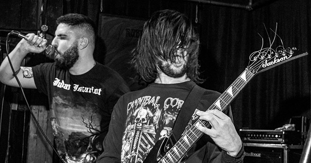Vocalist Alex Jones and guitarist Kyle Beam performing in the death metal band Undeath