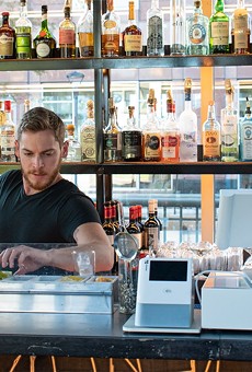 Adam tends the bar at VOLO.