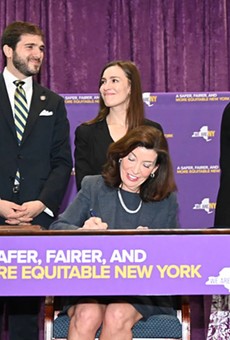 Gov. Kathy Hochul signs anti-sexual harassment laws on March 16, 2022.
