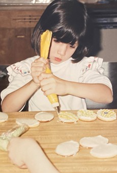 Petit Poutinerie Chef Lizzie Clapp at the baking table as a young girl.
