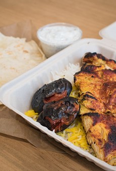 Chortke's spicy joojeh plate features grilled chicken and tomato over saffron basmati rice.