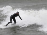 Surfer takes on Great Lakes and winter storms