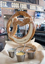 PHOTO BY RENÉE HEININGER - Perfect pairing for beer: the Biergarten Bavarian pretzel with an assortment of sauces, at New York Beer Project’s new Victor location.